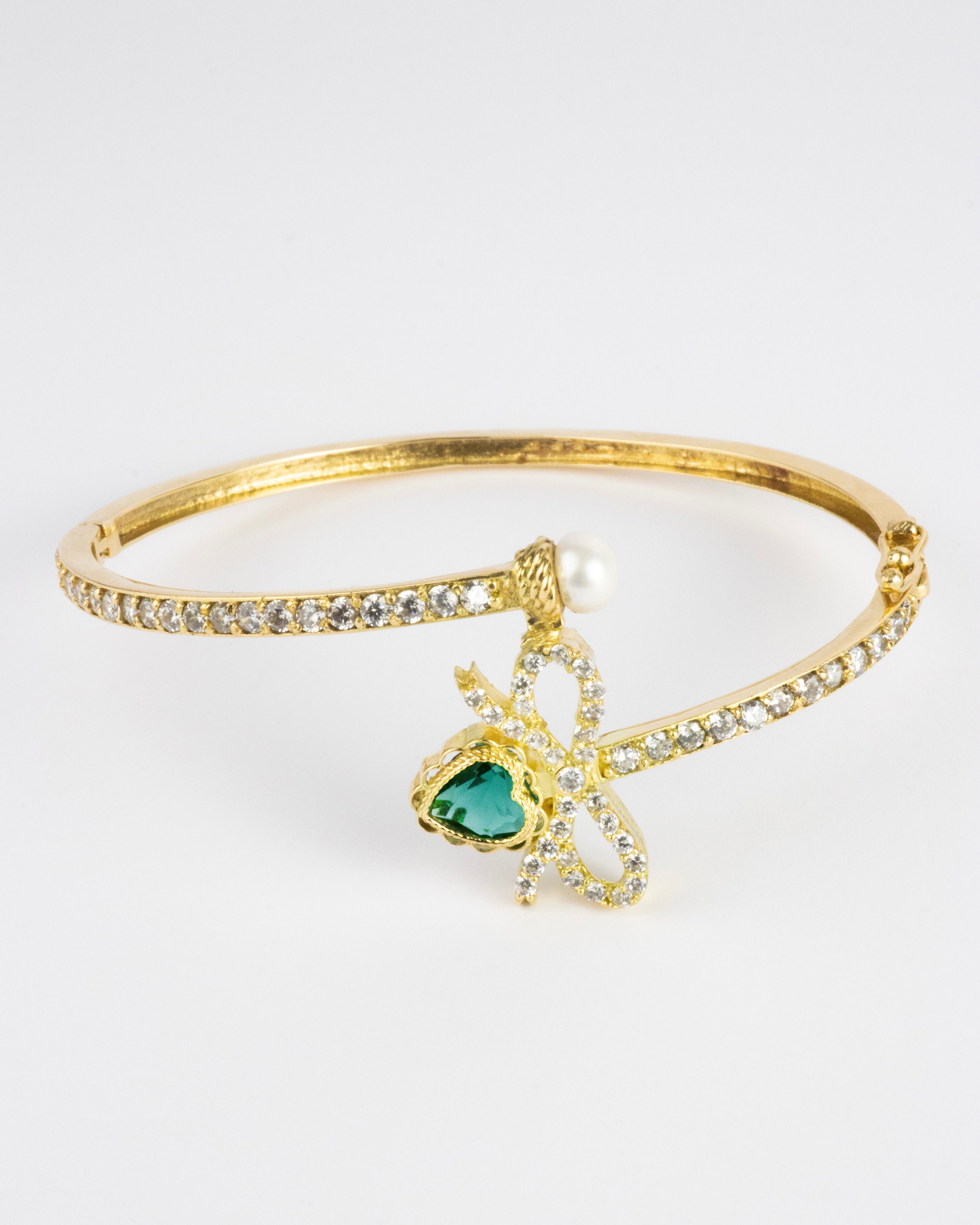 Aro moño de corazón / 1 Obsidiana / 1 Perla / 60 Circones Suizos / Oro 18 K