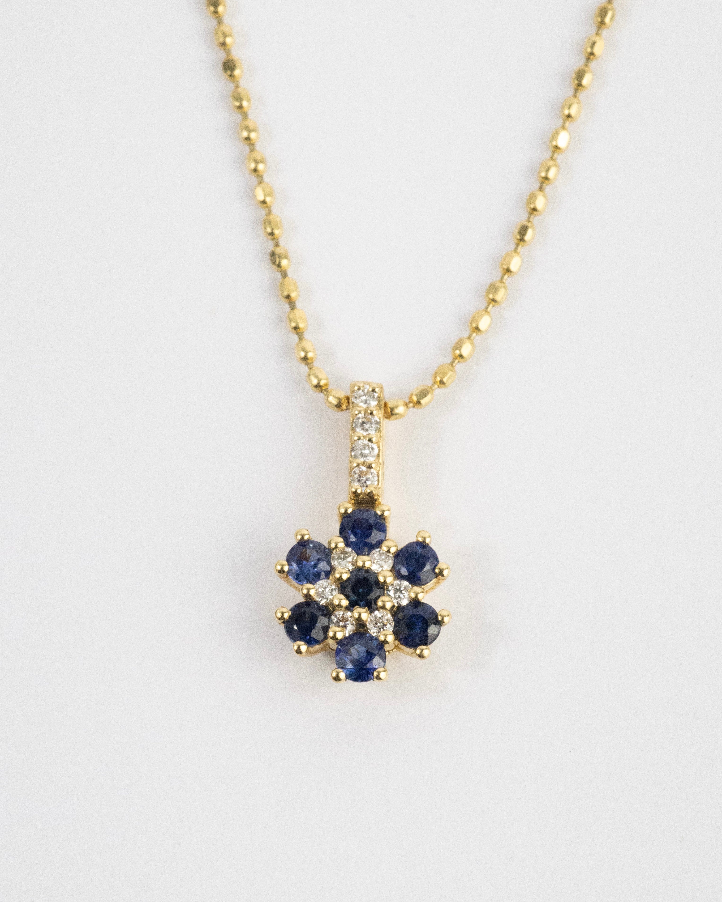 Dije flor de zafiros & diamantes / Medida - / 7 Zafiros / 10 Diamantes / Oro 18 K